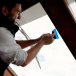 STEK Aqua Shade marine window tint getting installed